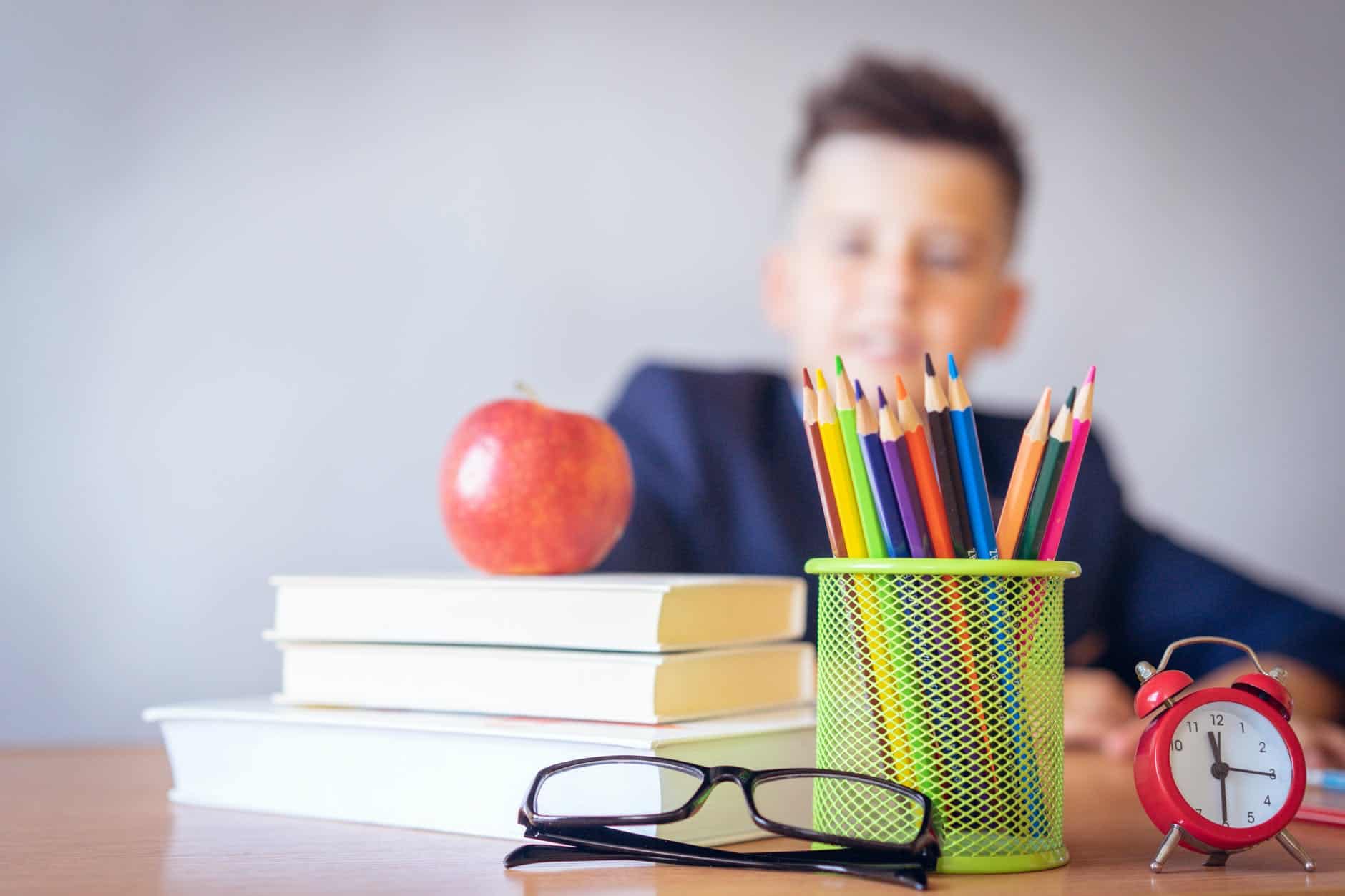 boy looking on a tidied desk